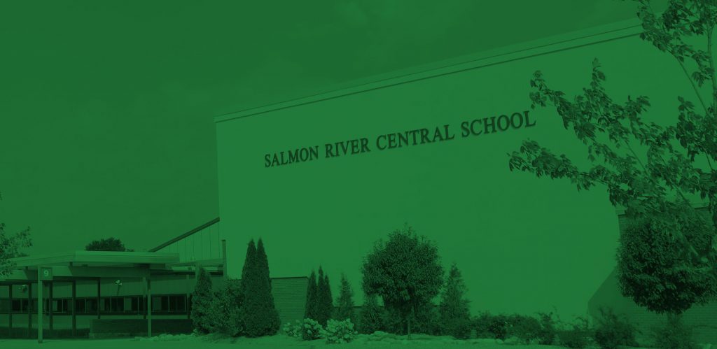 closeup image of Salmon River school buildings with green filter overlay